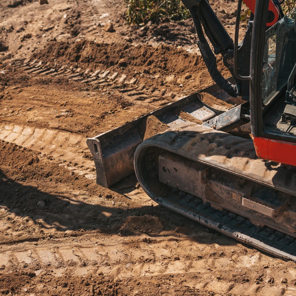Close up of an excavator wheels on a construction site